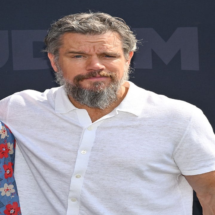 Man with a beard wearing a casual short-sleeve shirt at an outdoor event