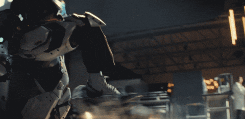 A character in a high-tech suit flies through a dimly lit space, with mechanical components visible. \"Ironheart\" and Disney logos are present