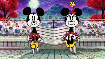 Mickey and Minnie Mouse, in animated style, stand together on a scenic bridge with trees and a city skyline in the background