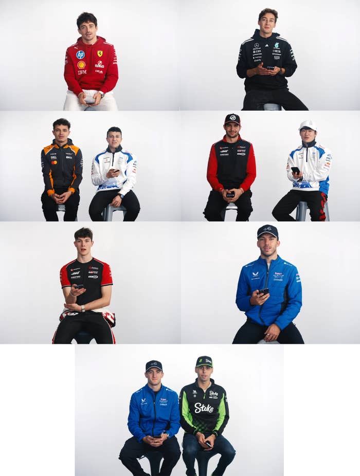A clump  of F1 drivers sitting holding phones
