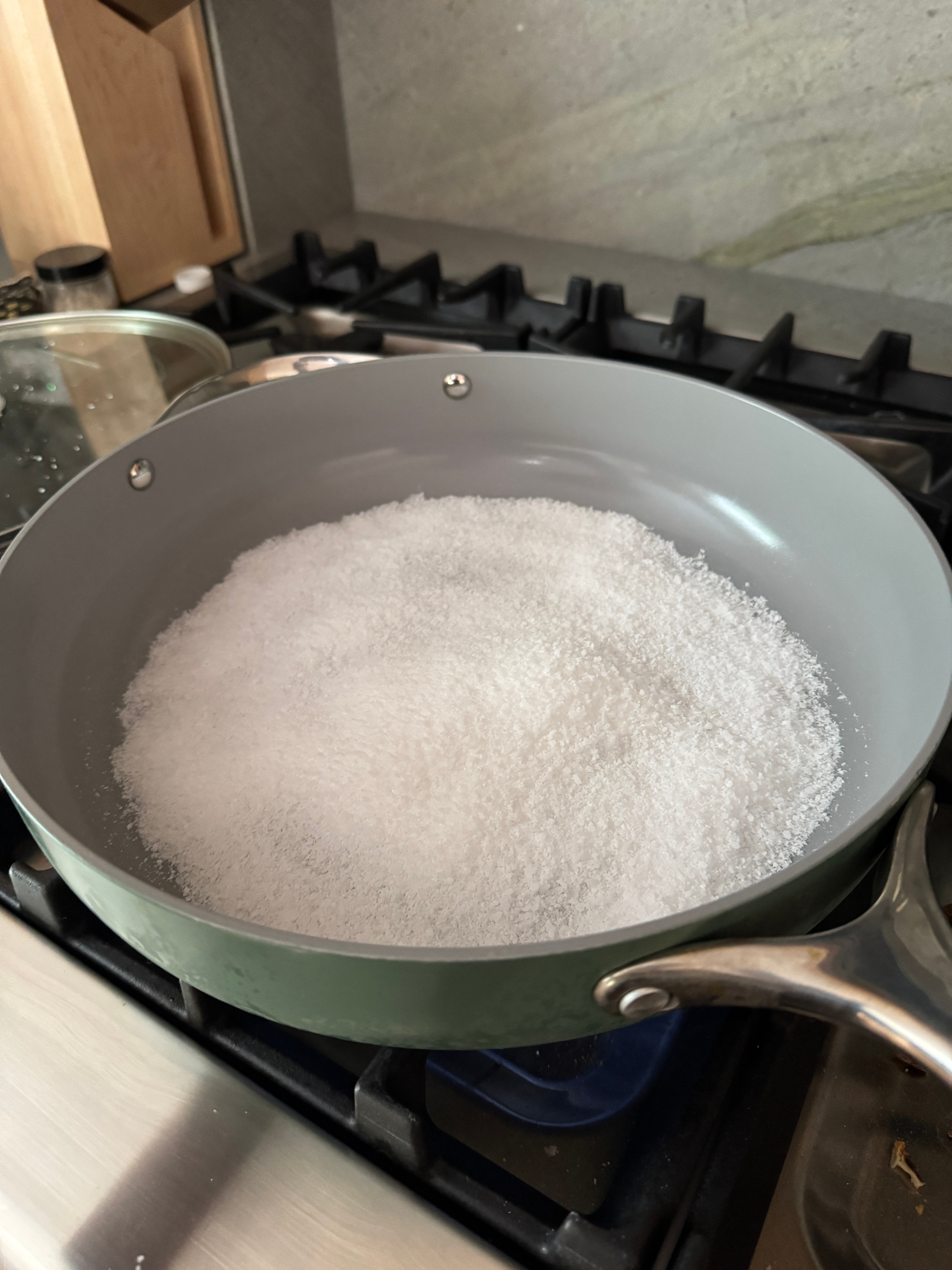 Salt melting in a pan on a stove