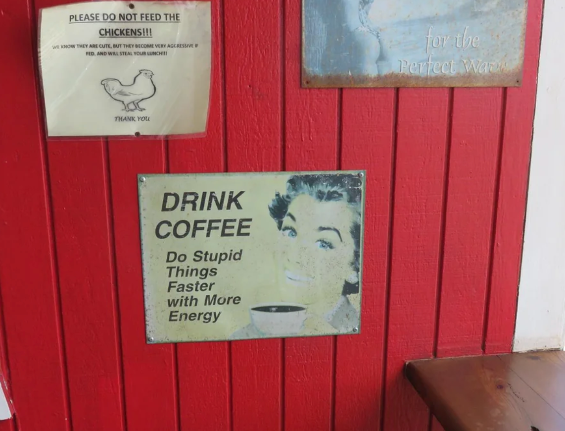 Sign humorously urging coffee consumption: &quot;Drink coffee. Do stupid things faster with more energy.&quot;
