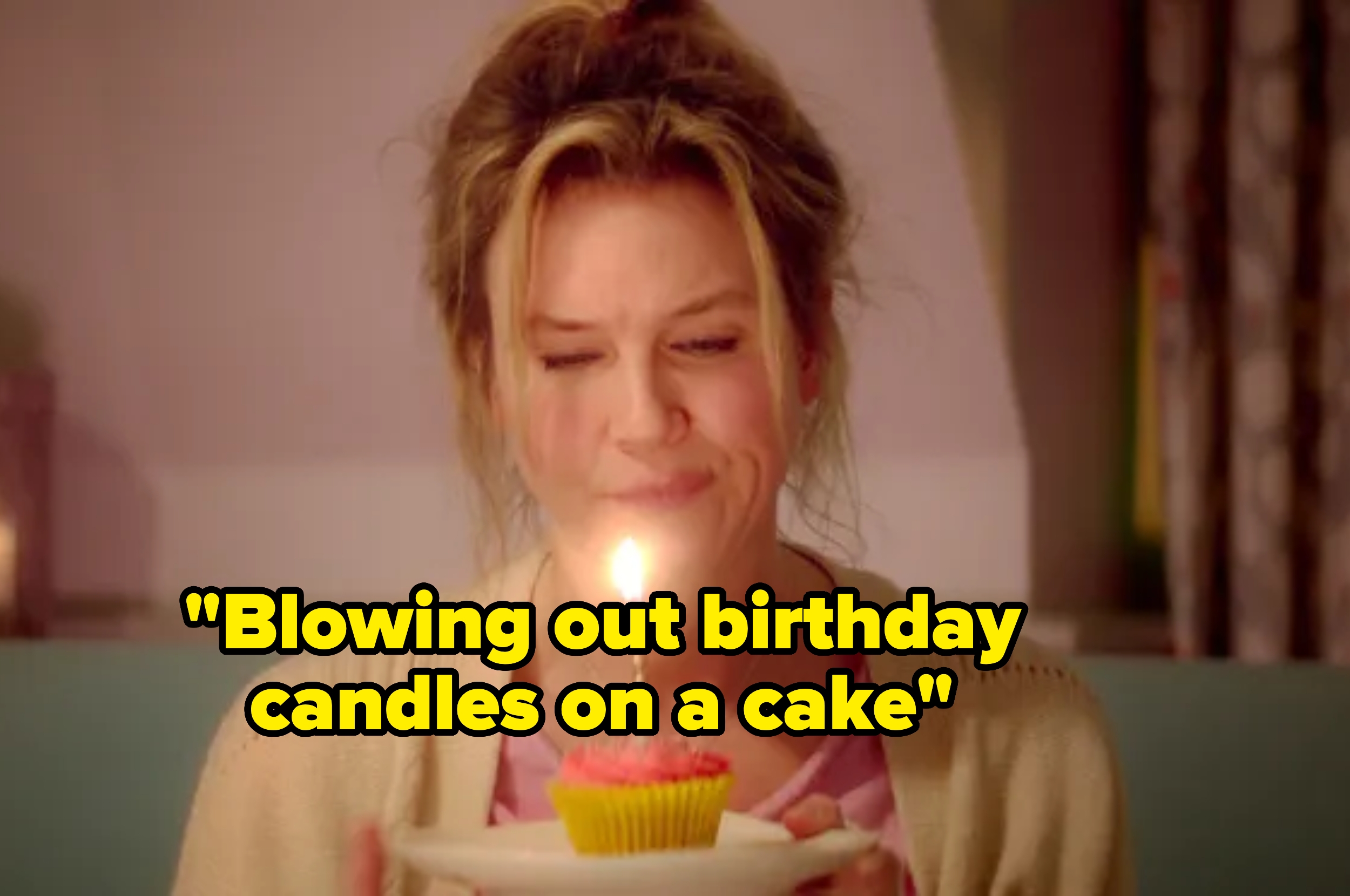 Person holding a birthday cake with a candle, caption: "Blowing out birthday candles on a cake."