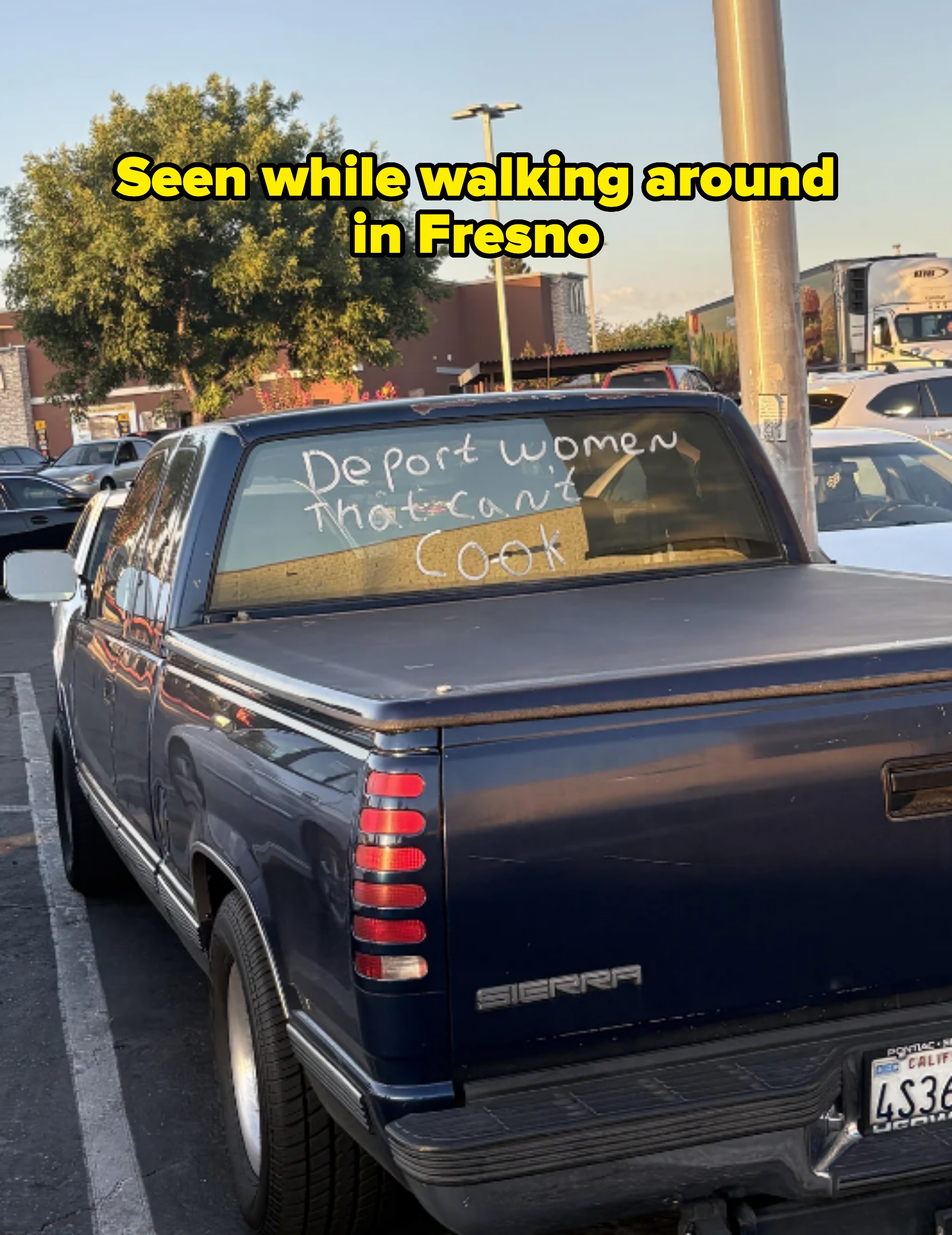 Back of a parked pickup truck with the words &quot;Deport women that can&#x27;t cook&quot; written on the rear window. Seen in Fresno