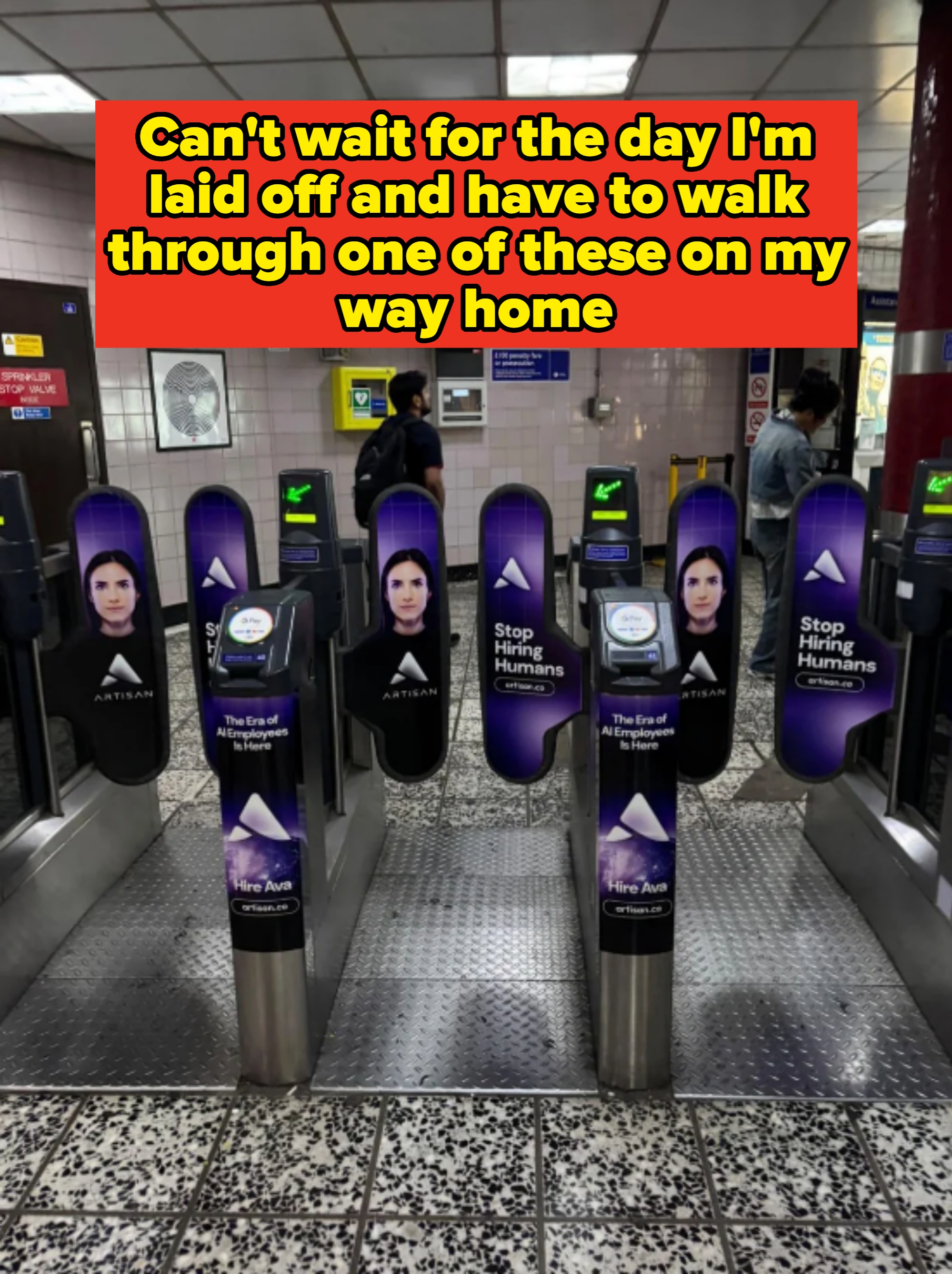 Subway turnstiles display ads featuring a person’s face and the text: &quot;Stop hiring humans&quot; and &quot;Hire Ava,&quot; promoting a digital assistant service. Caption: &quot;Can&#x27;t wait for the day I&#x27;m laid off and have to walk through one of these on my way home&quot;
