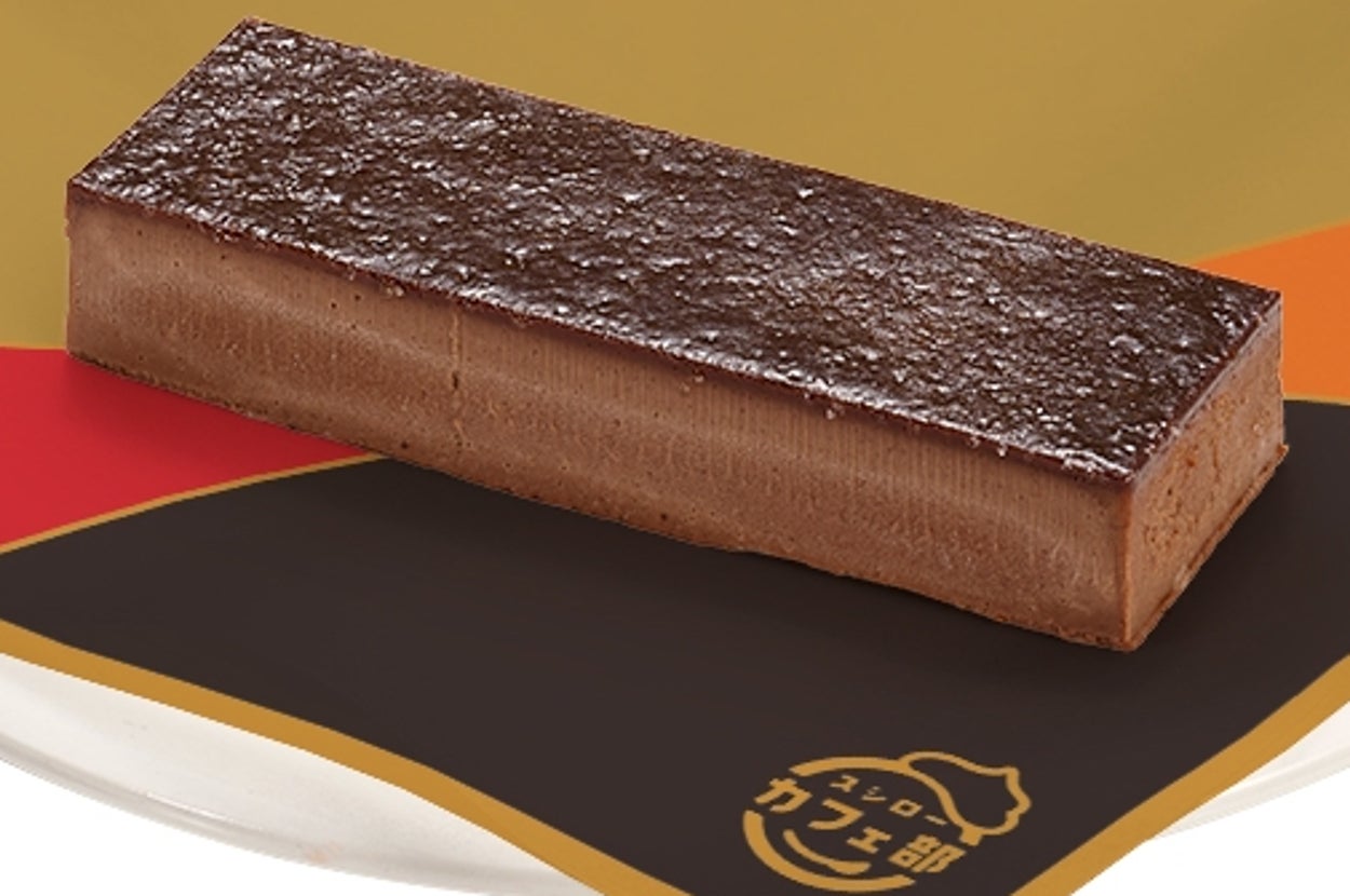 ゴディバのチョコレートバーがカラフルな紙の上に置かれている。シンプルで高級感あるデザインの広告イメージです。