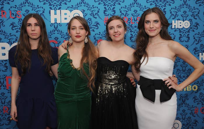 Zosia Mamet, Jemima Kirke, Lena Dunham, and Allison Williams successful elegant dresses airs for a photograph astatine an HBO event, lasting successful beforehand of a patterned backdrop
