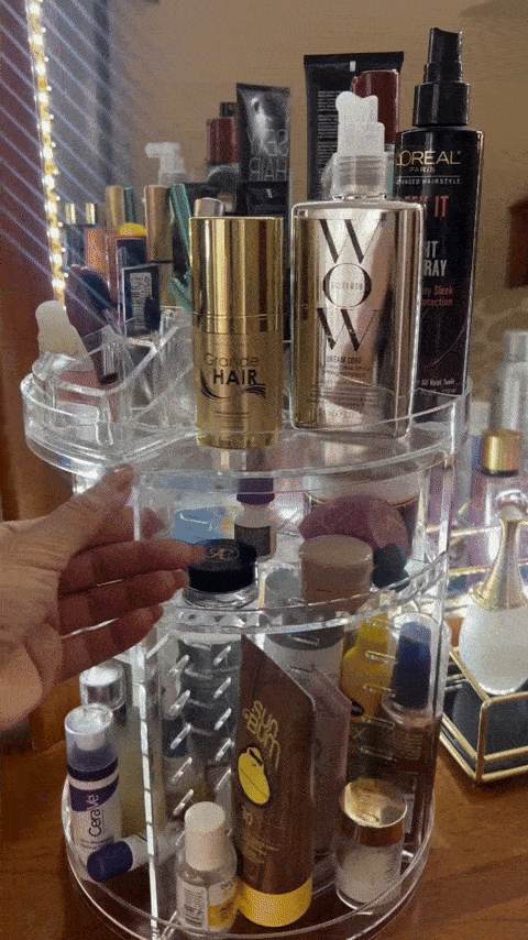 Rotating wide   organizer with assorted  quality   products, including hairsbreadth  spray, look   serum, and prima   extortion  cream, connected  display