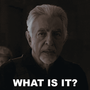 Older man with gray hair and mustache saying, &quot;What is it?&quot; while looking intently off-screen