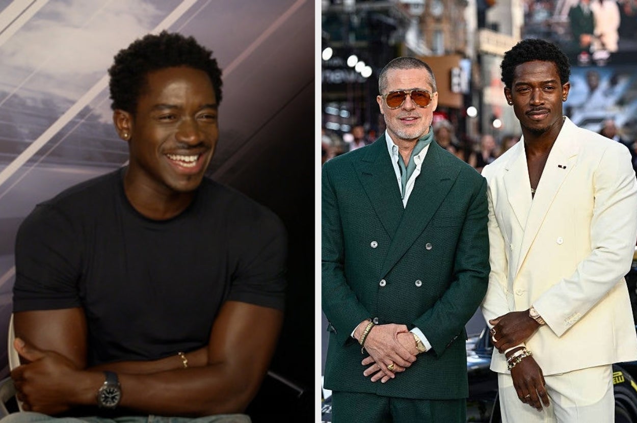 Two men posing together; one in a dark green suit and sunglasses, and the other in a white suit, both on a red carpet