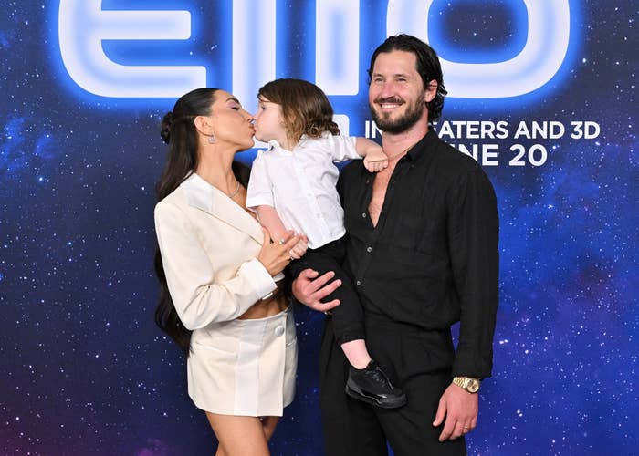 Jenna Johnson poses connected  a reddish  carpet with their child. The pistillate   wears a light, stylish suit; the antheral   is successful  a acheronian  garment  and pants