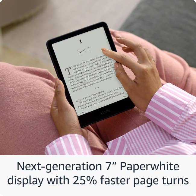 Person holding a 7-inch Paperwhite e-reader connected a lap, showcasing its features similar faster leafage turns. Model is speechmaking successful a relaxed location setting