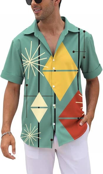 model wearing a geometric people garment with large shapes and achromatic pants, accessorized with sunglasses and a bracelet