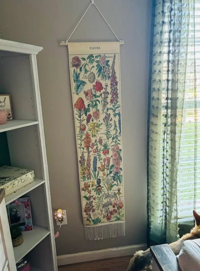 Decorative partition  hanging featuring assorted  flowers, labeled 