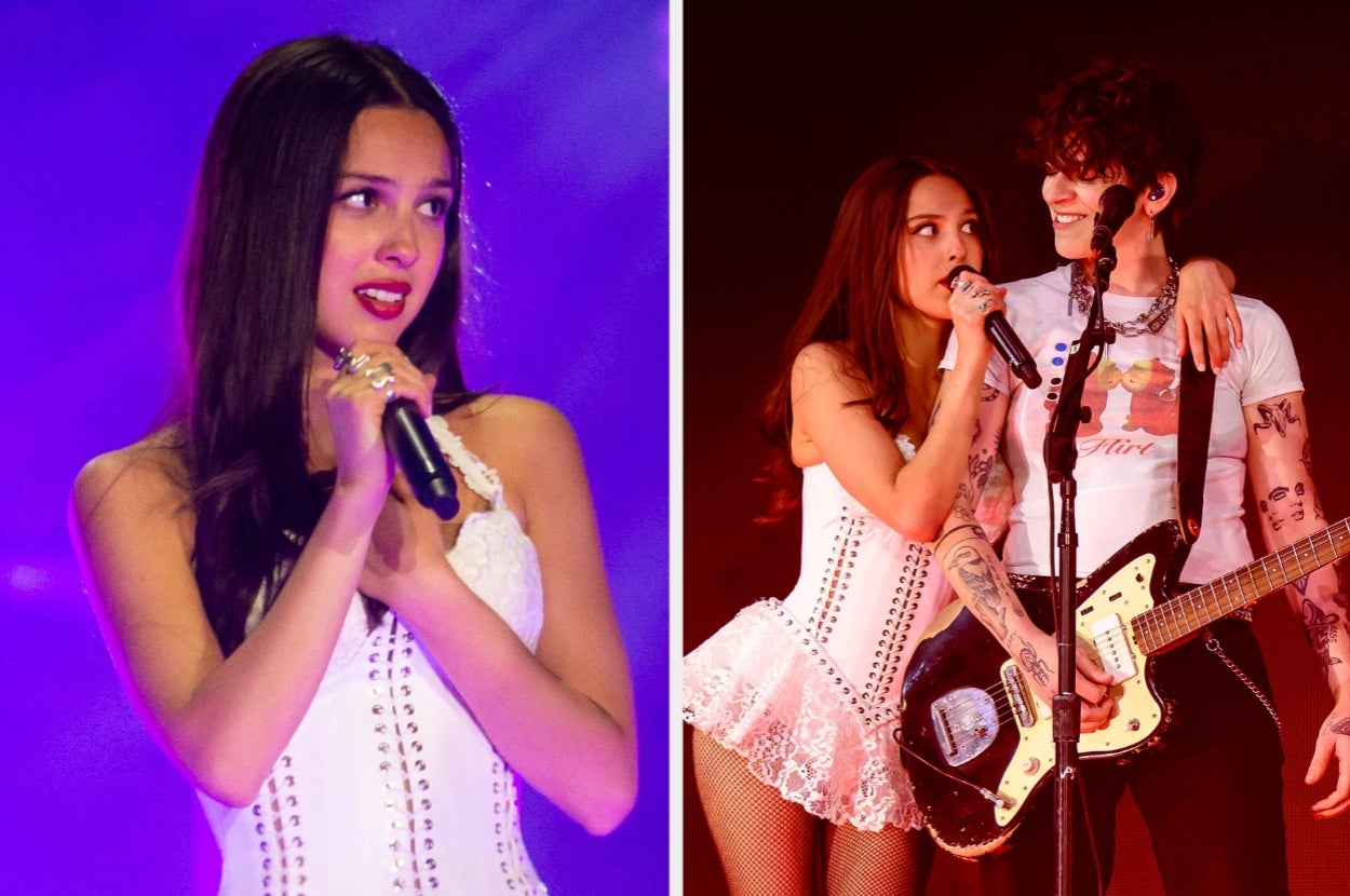 Olivia Rodrigo sharing a moment with her guitarist during a heartfelt stage performance.