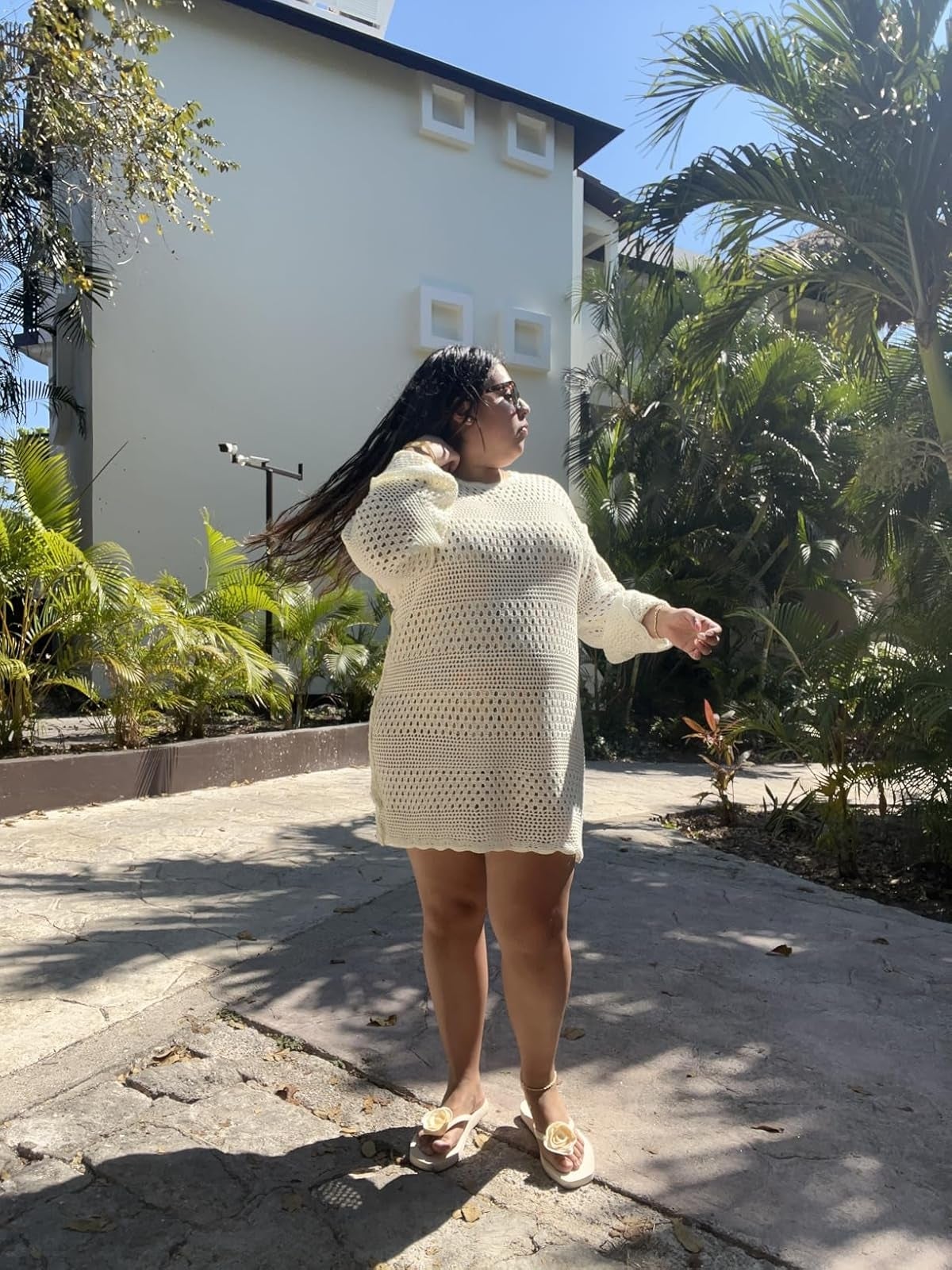 Person outdoors wearing a crochet-style formal  and sandals