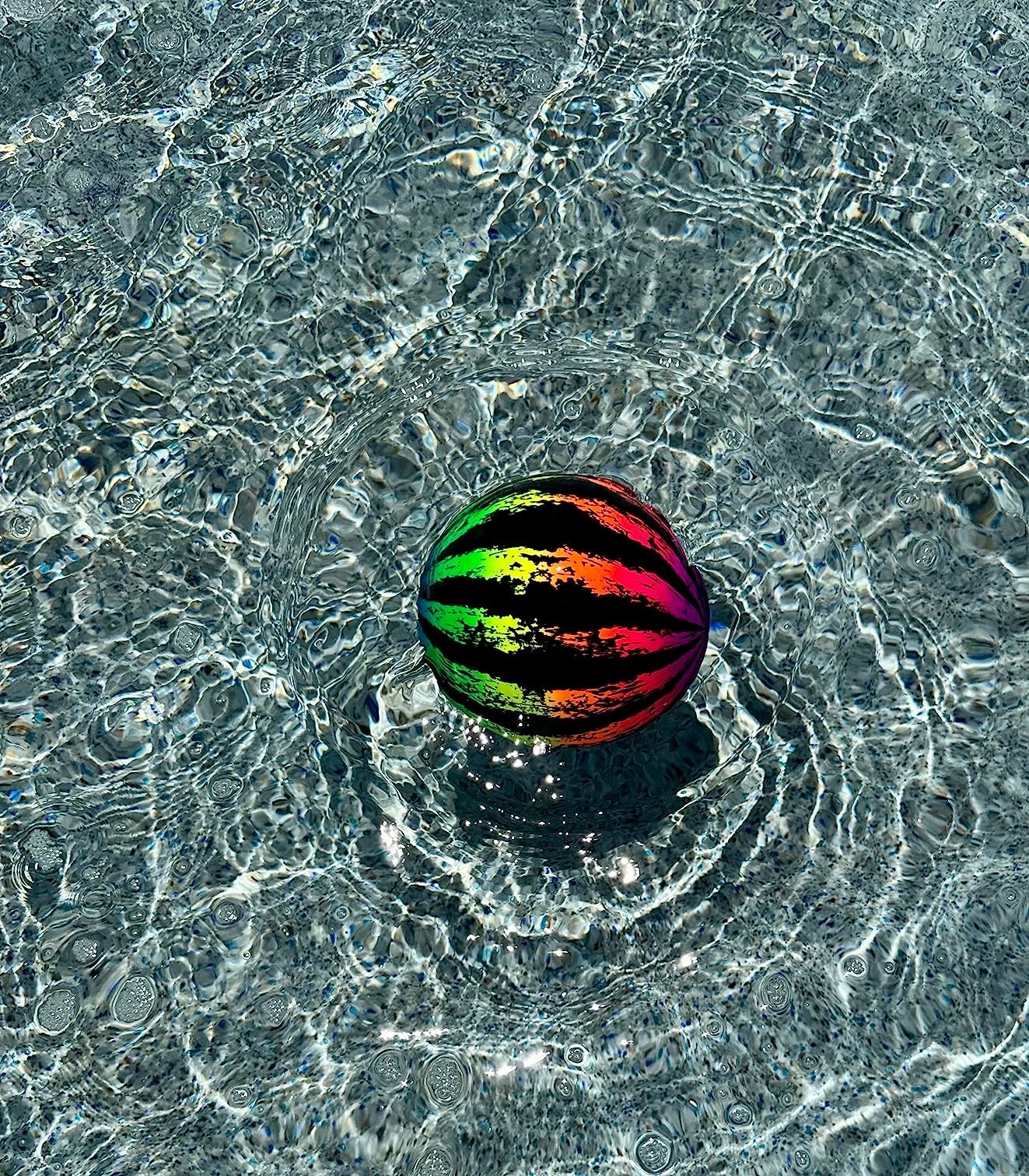 A round, brightly patterned floating shot  connected  water, creating ripples. Ideal for summertime  excavation  play, featured successful  a buying  guide