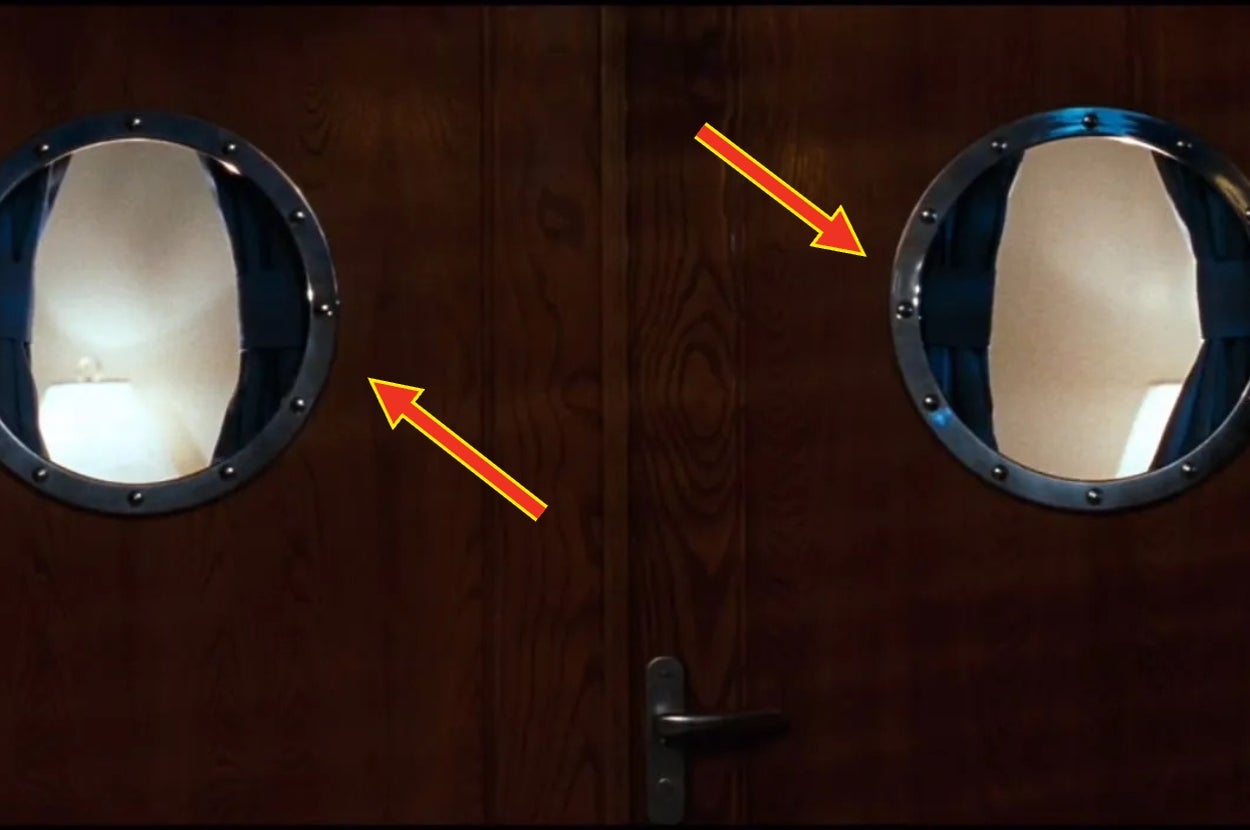 Two wooden doors with round windows showing white walls and a reflection of a lamp, arrows pointing at window edges
