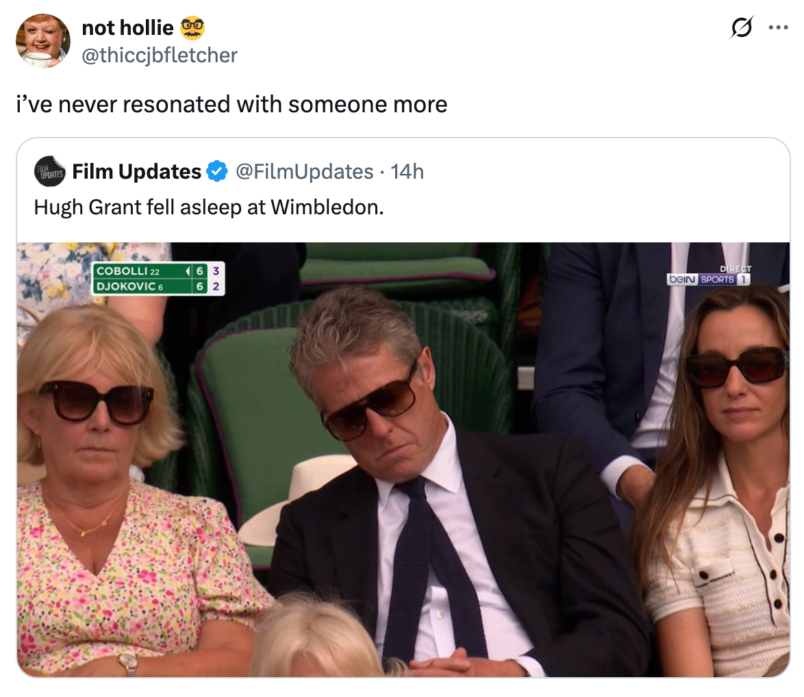 Tweet with a photo of a person, reportedly Hugh Grant, asleep at Wimbledon. They are sitting between two others attending the match