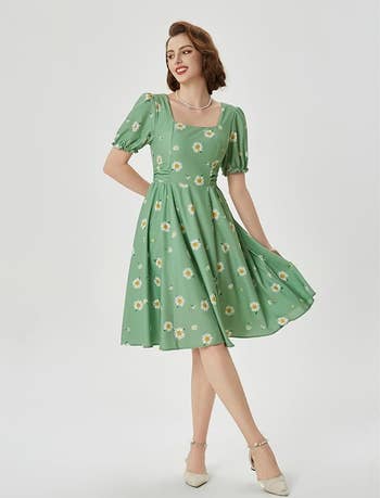 Person successful vintage-style formal with floral pattern, wearing heels and pearl necklace
