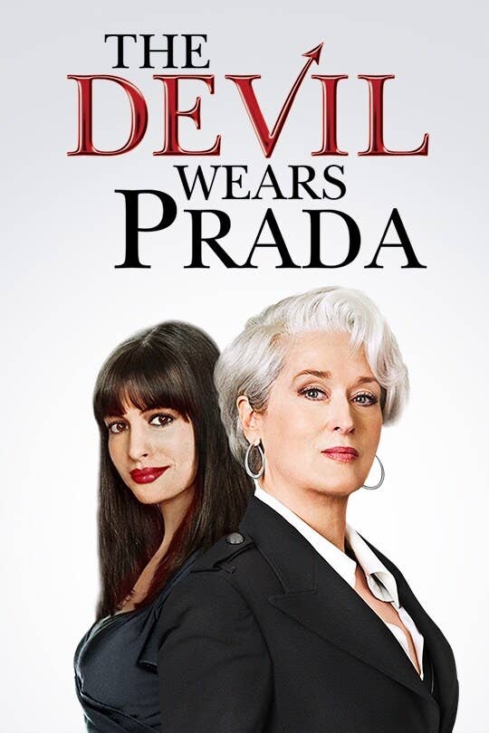 Two women pose against a white background under the title "The Devil Wears Prada." One wears a sleek black outfit, the other a formal black blazer