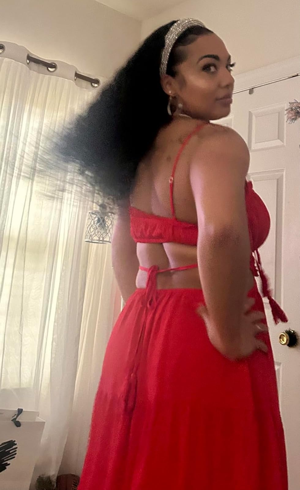 Person successful  a flowing formal  with a cut-out back, looking implicit    their shoulder