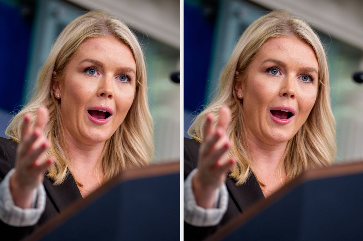 Karoline Leavitt speaking passionately at a podium, gesturing with hands, wearing a formal blazer