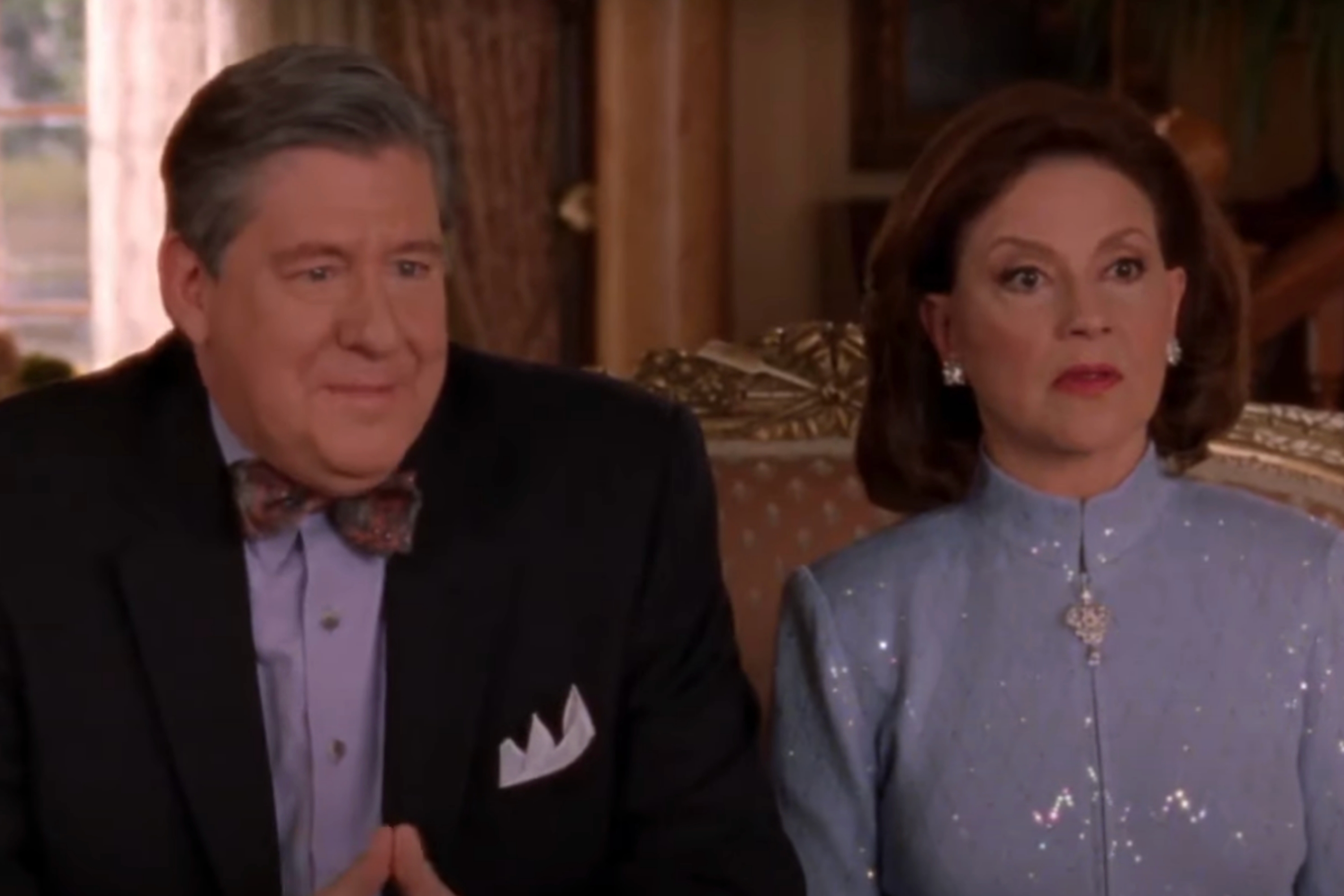 Couple sitting indoors; caption reads, "My fiancé's parents are loaded. Old money loaded."