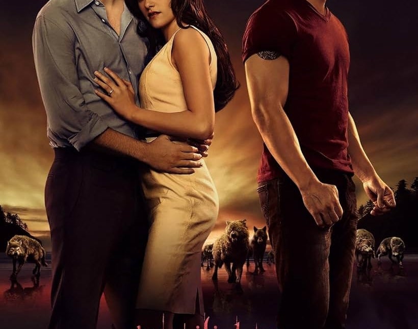 Three actors on a &quot;Twilight Saga: Breaking Dawn Part 1&quot; poster. Two stand closely together; one wears a dark shirt, the other a white dress