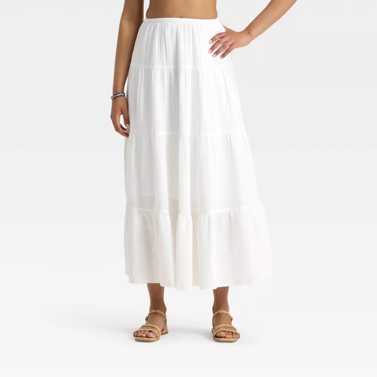 Model wearing white skirt