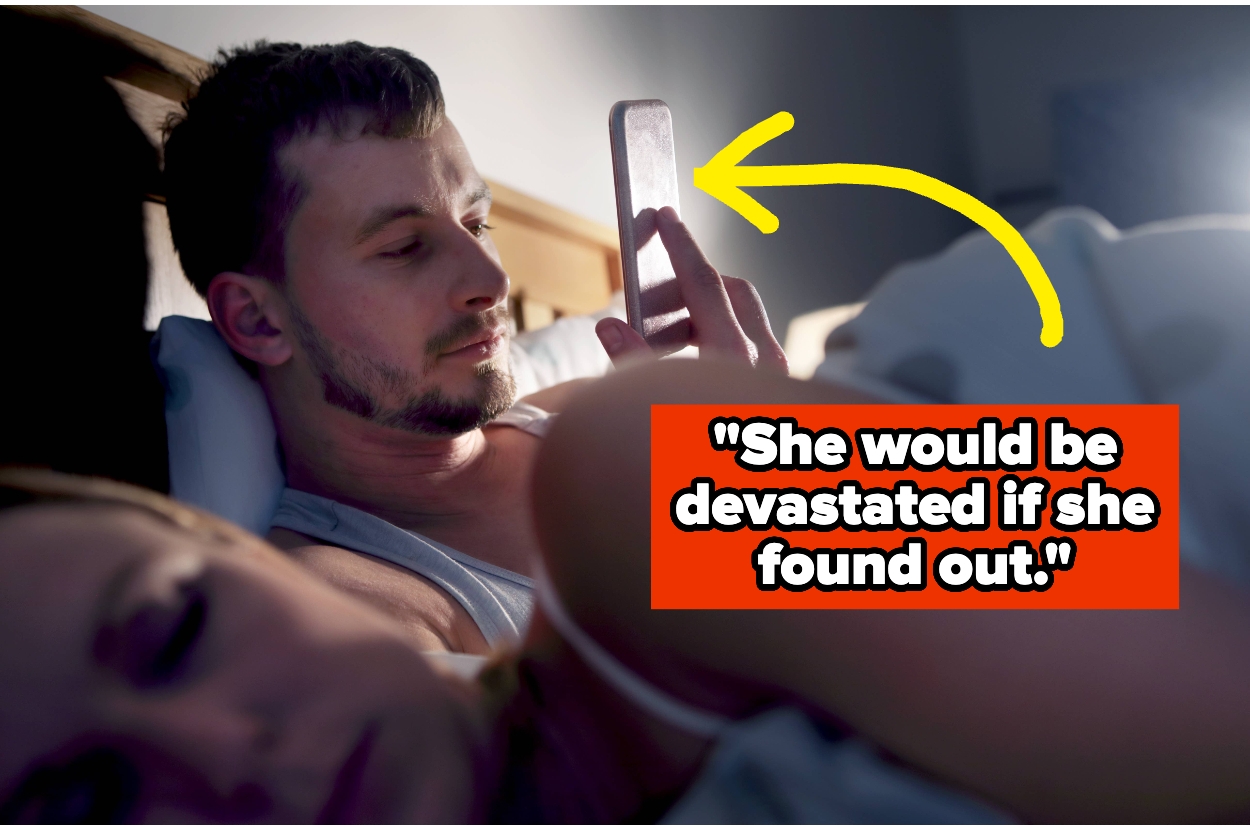 Man in bed secretly using phone, with partner asleep beside him. Text: "She would be devastated if she found out."