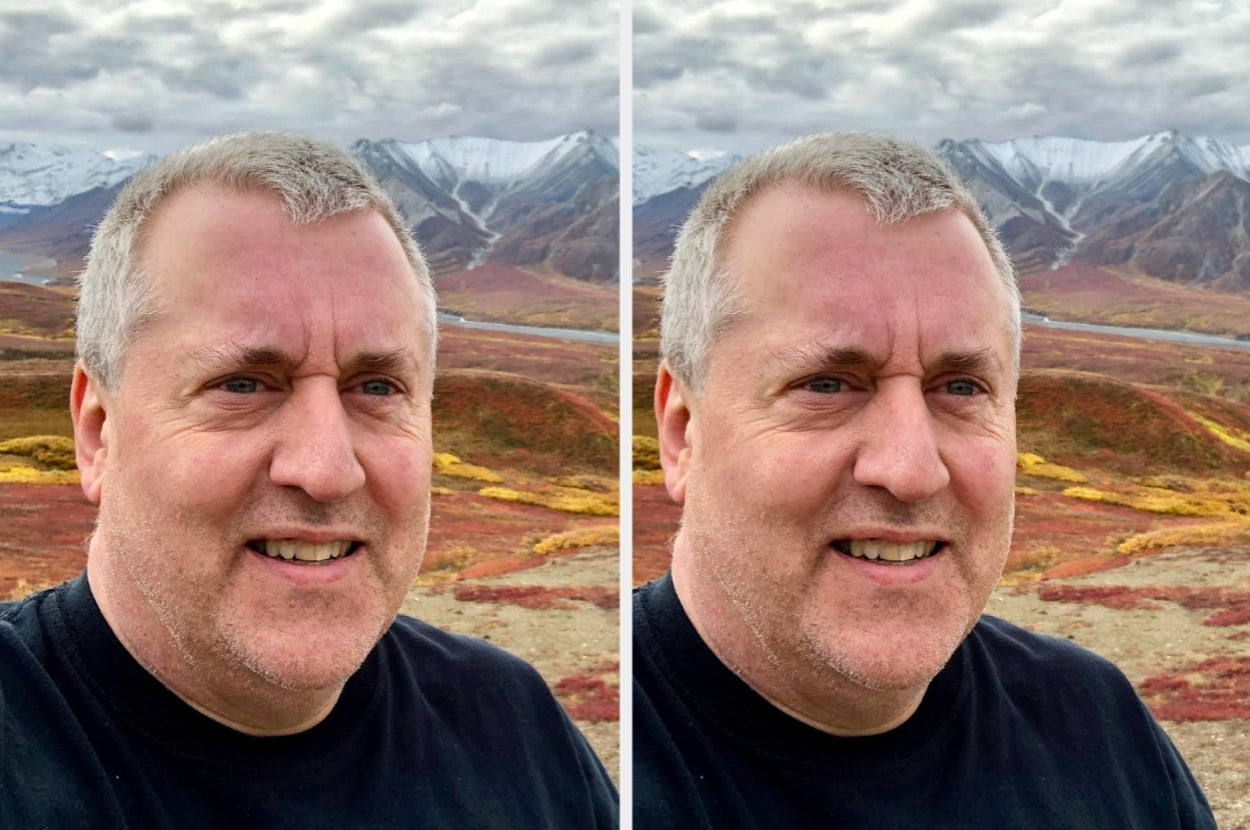 A person outdoors in a mountainous landscape, smiling for a selfie
