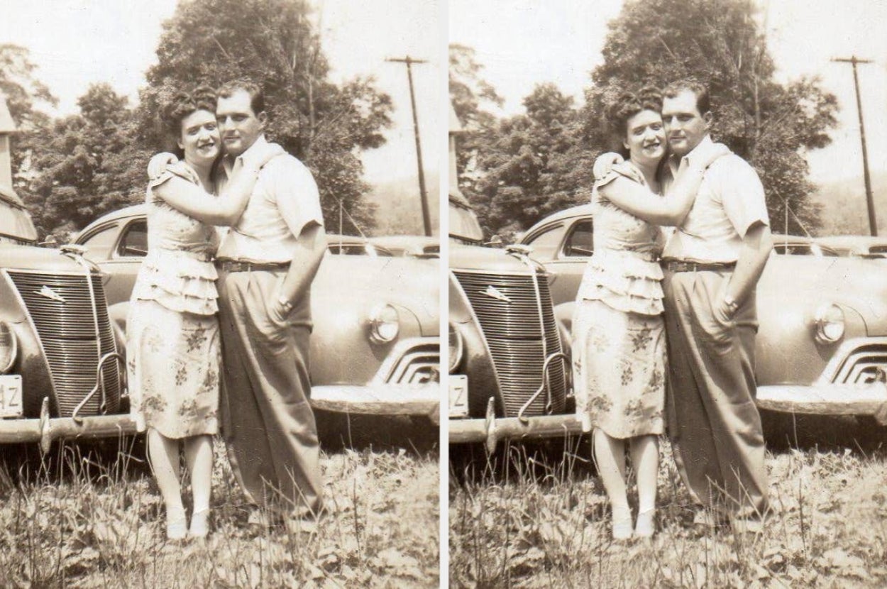 Vintage photo of a smiling couple posing by a classic car, with the woman embracing the man. Trees and utility poles are visible in the background