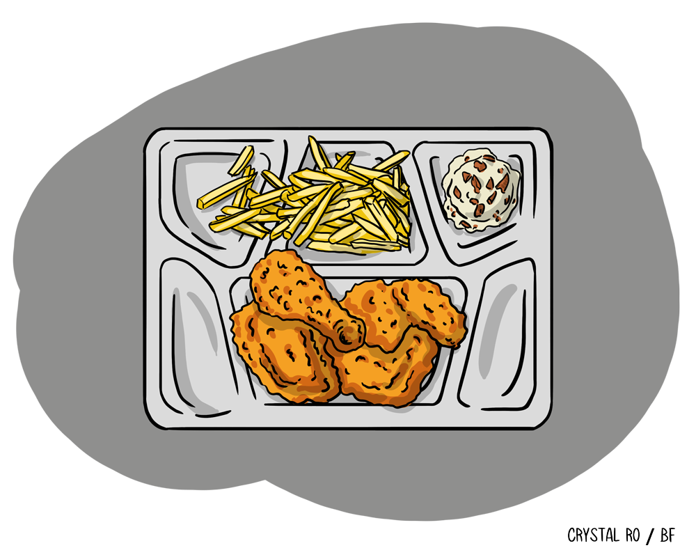 Lunch tray with fried chicken, fries, and a cookie