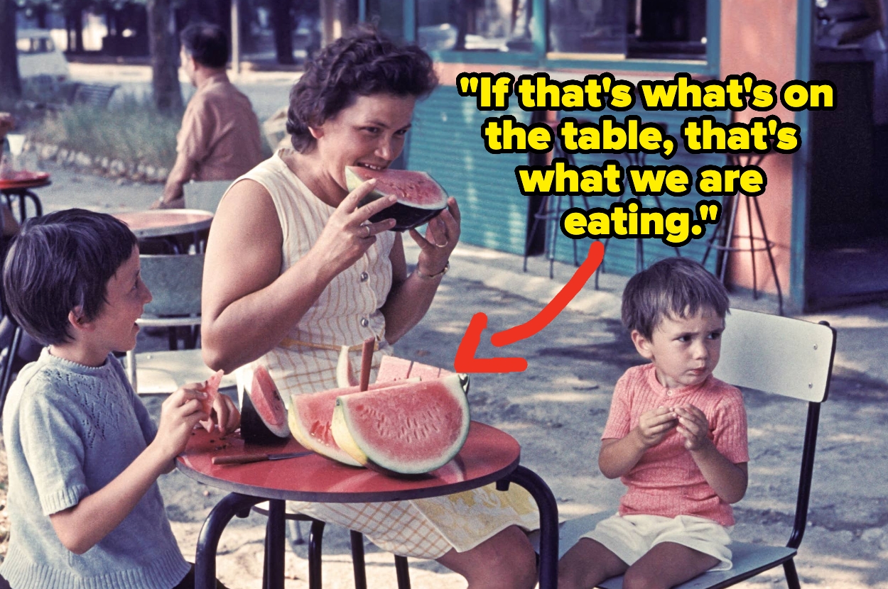 A woman and two children sit outside eating watermelon. A text overlay reads, "If that's what's on the table, that's what we are eating."