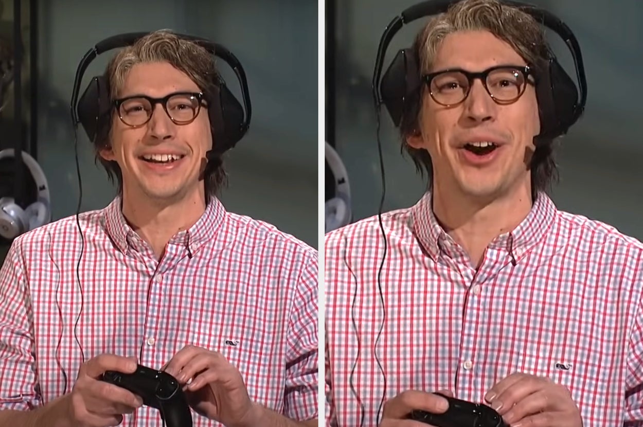 Man with glasses humorously mimics eating a cookie in a kitchen setting