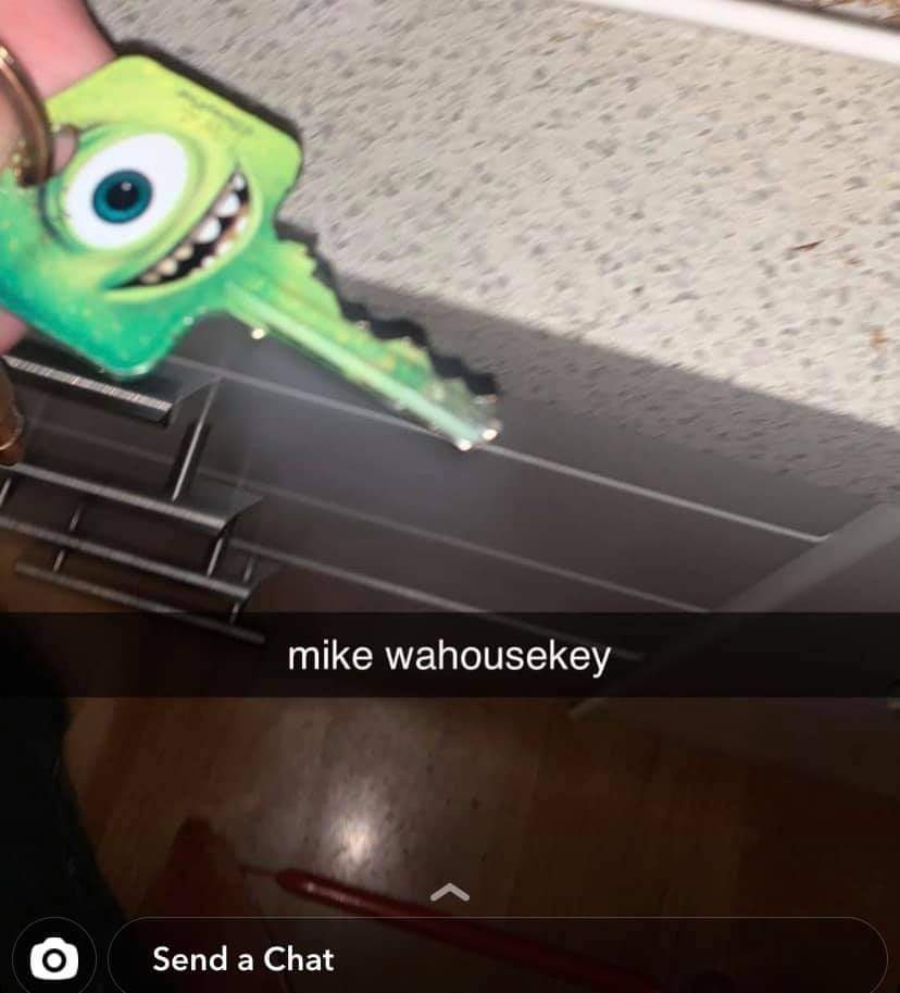 Keychain shaped like a green cartoon character with one eye. Below, Snapchat caption jokes, "mike wahousekey."