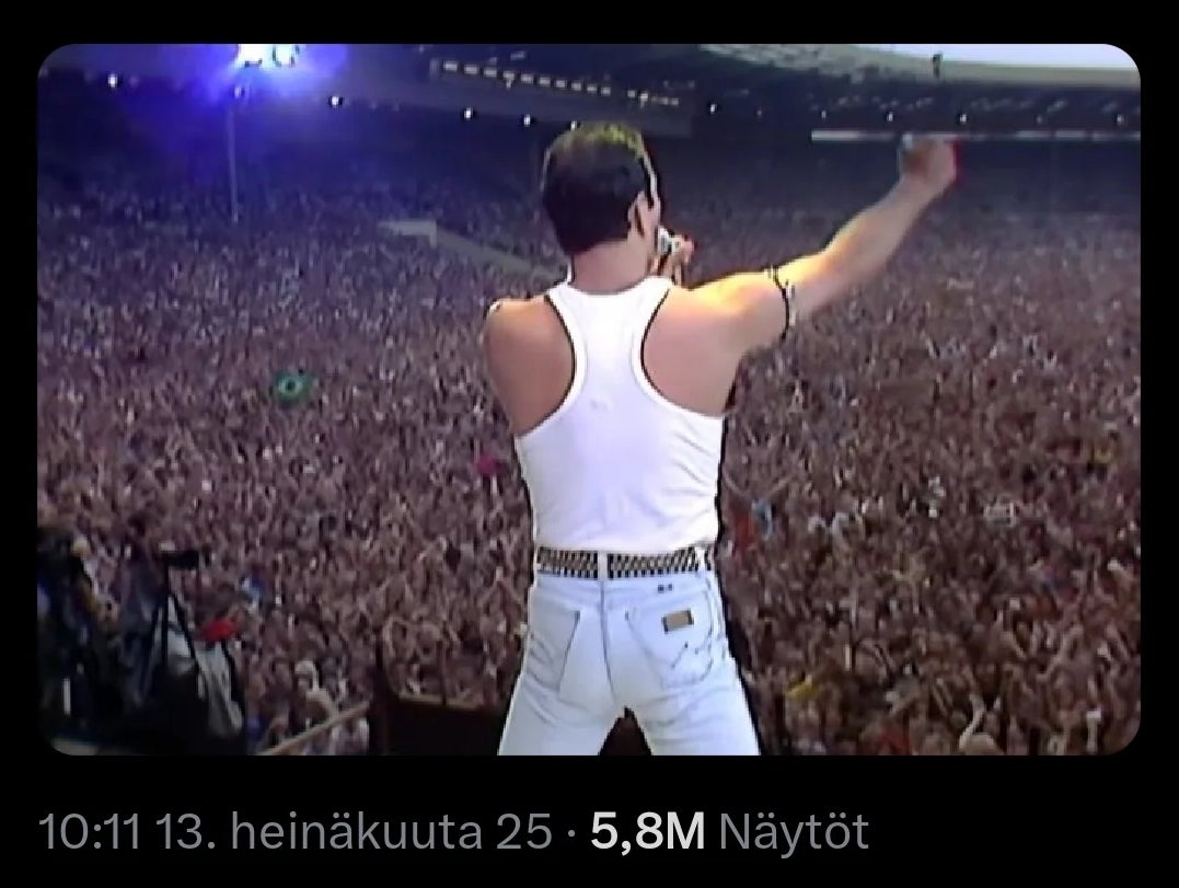 Freddie Mercury facing a ample  assemblage  astatine  Live Aid; substance   overlay says, "No governmental  flags and nary  lectures"