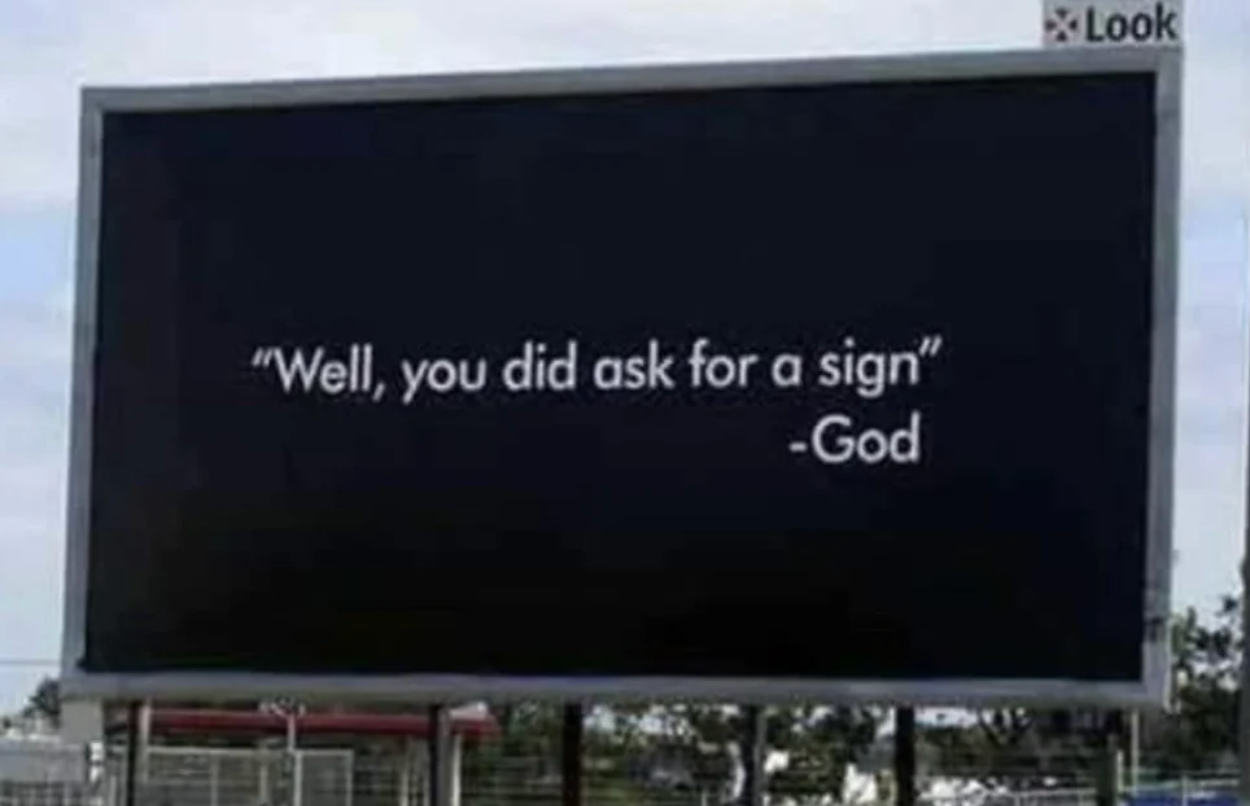 A billboard displays the message: &quot;Well, you did ask for a sign&quot; - God