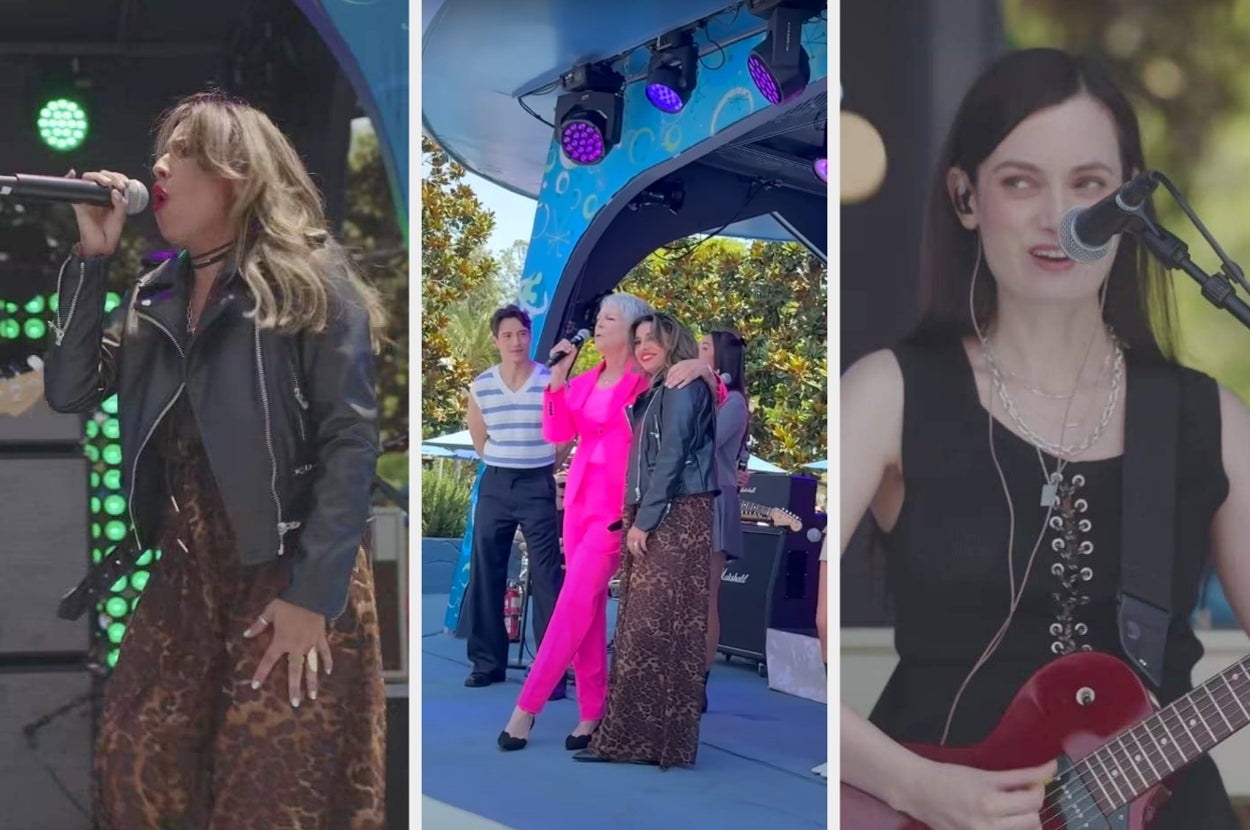 Three singers perform on stage. Left: singer with a mic, wearing a leather jacket and leopard print skirt. Center: singer in bright suit. Right: guitarist singer