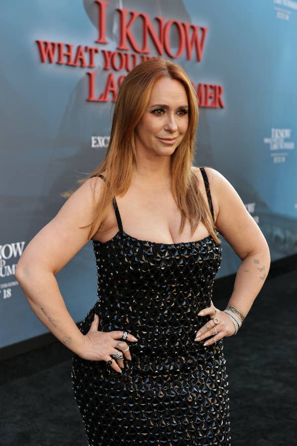 Person on the red carpet in a studded black dress at an event for &quot;I Know What You Did Last Summer.&quot;
