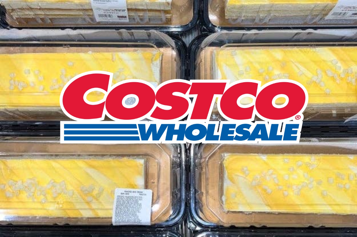 Costco's peach cakes in plastic containers, topped with icing and sugar crystals, displayed in-store