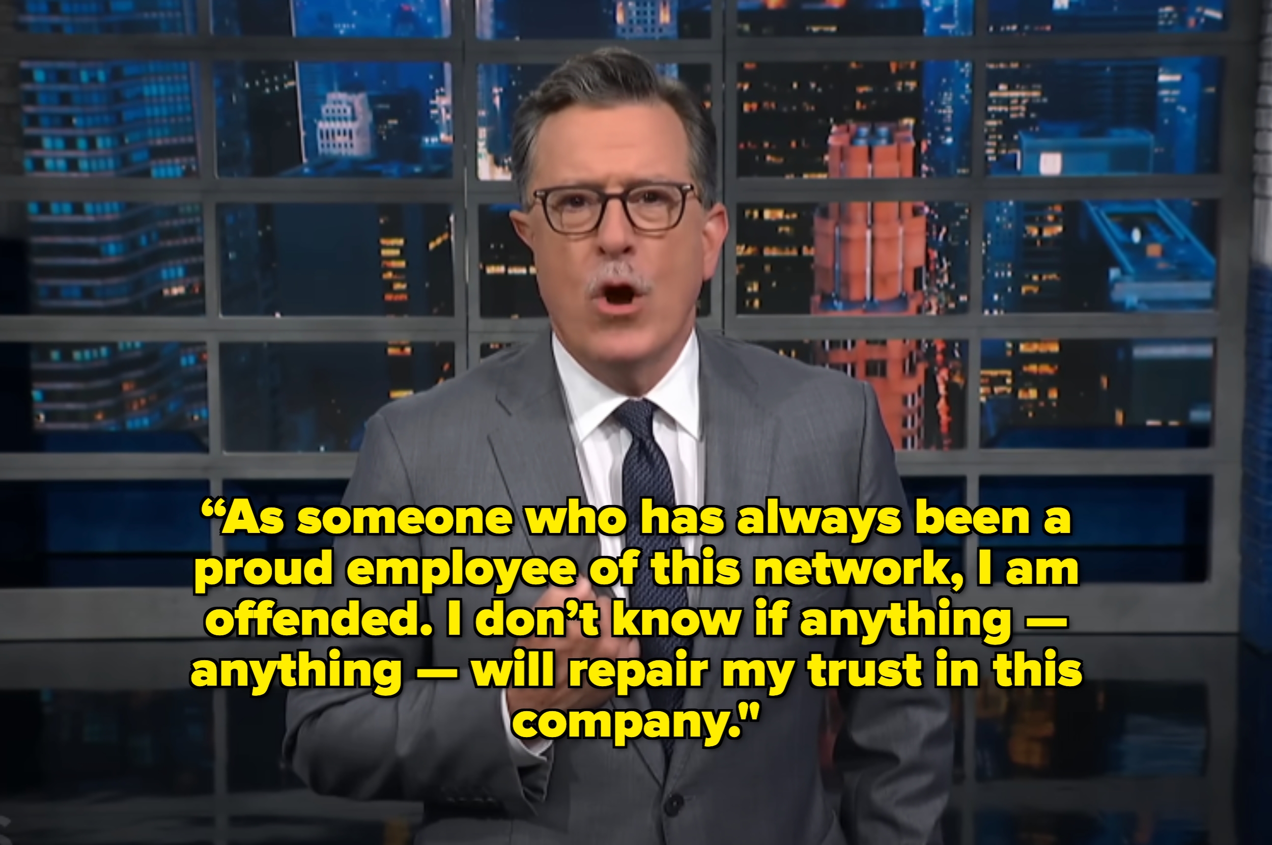 Man in a suit on a TV set with cityscape background, quoted saying he&#x27;s offended and unsure if his trust in his company can be repaired