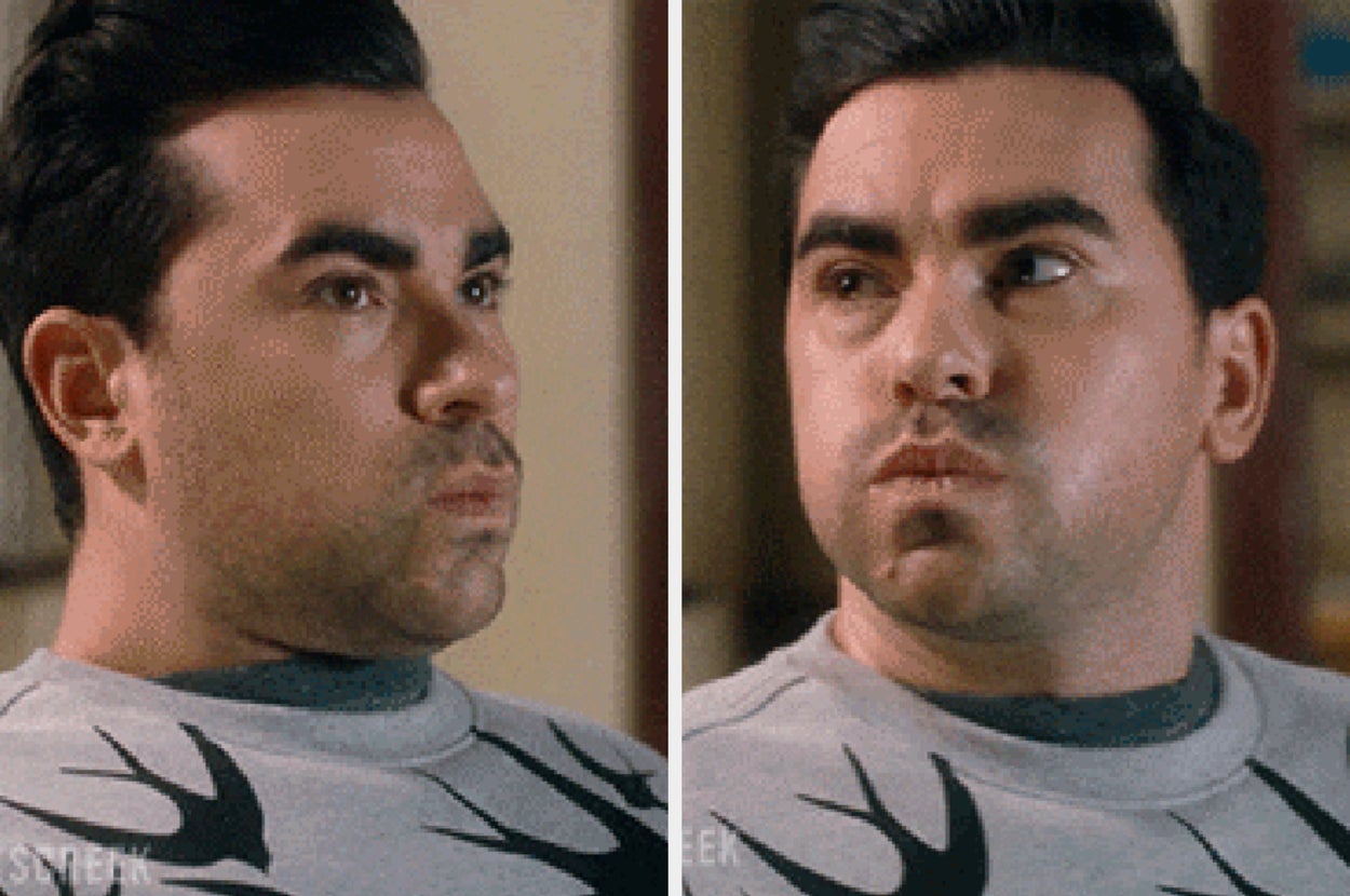 Person with an amused expression, wearing a shirt with a deer motif. They appear to be in a light-hearted setting