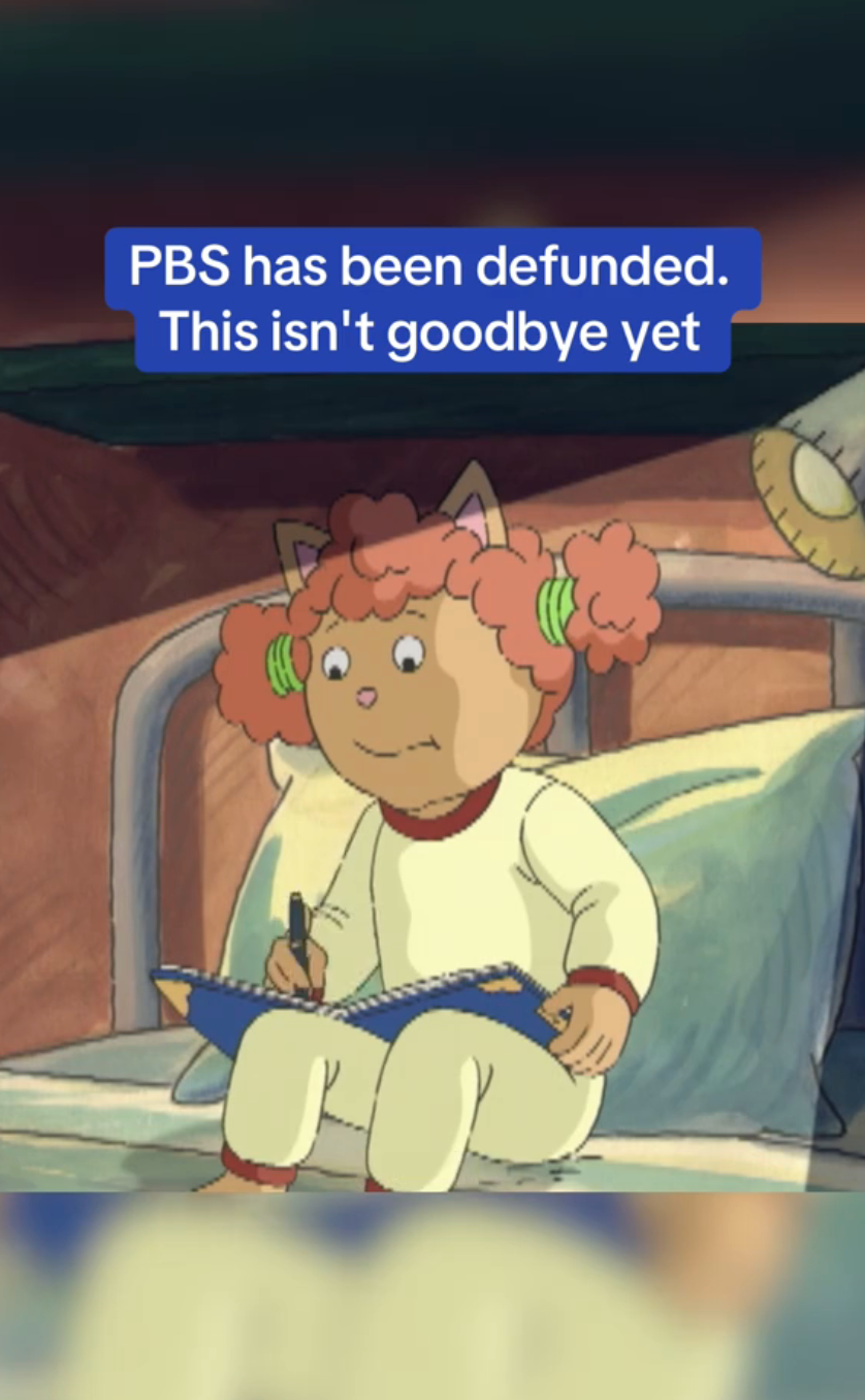 Cartoon character with cat ears, sitting on a bed, looks worried while holding a notebook. Text reads: &quot;PBS has been defunded. This isn&#x27;t goodbye yet.&quot;