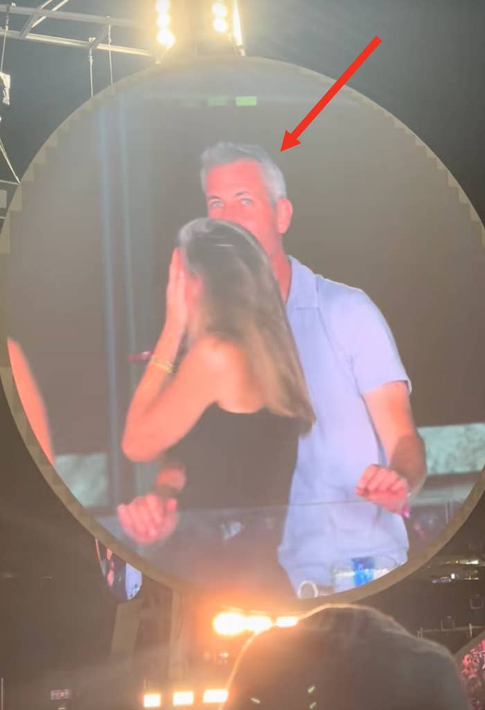 Andy Byron and Kristin Cabot hide on a kiss cam at a Coldplay concert