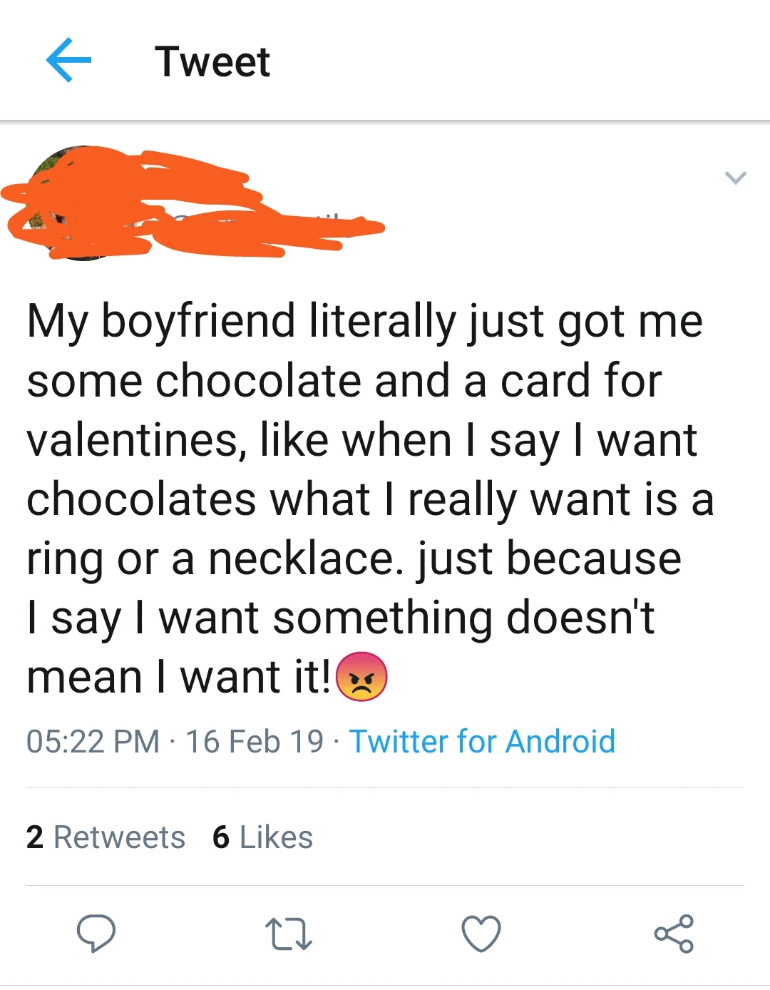 Tweet expressing frustration that their boyfriend gave chocolates and a card instead of jewelry for Valentine's Day, even though she only asked for chocolate and a card