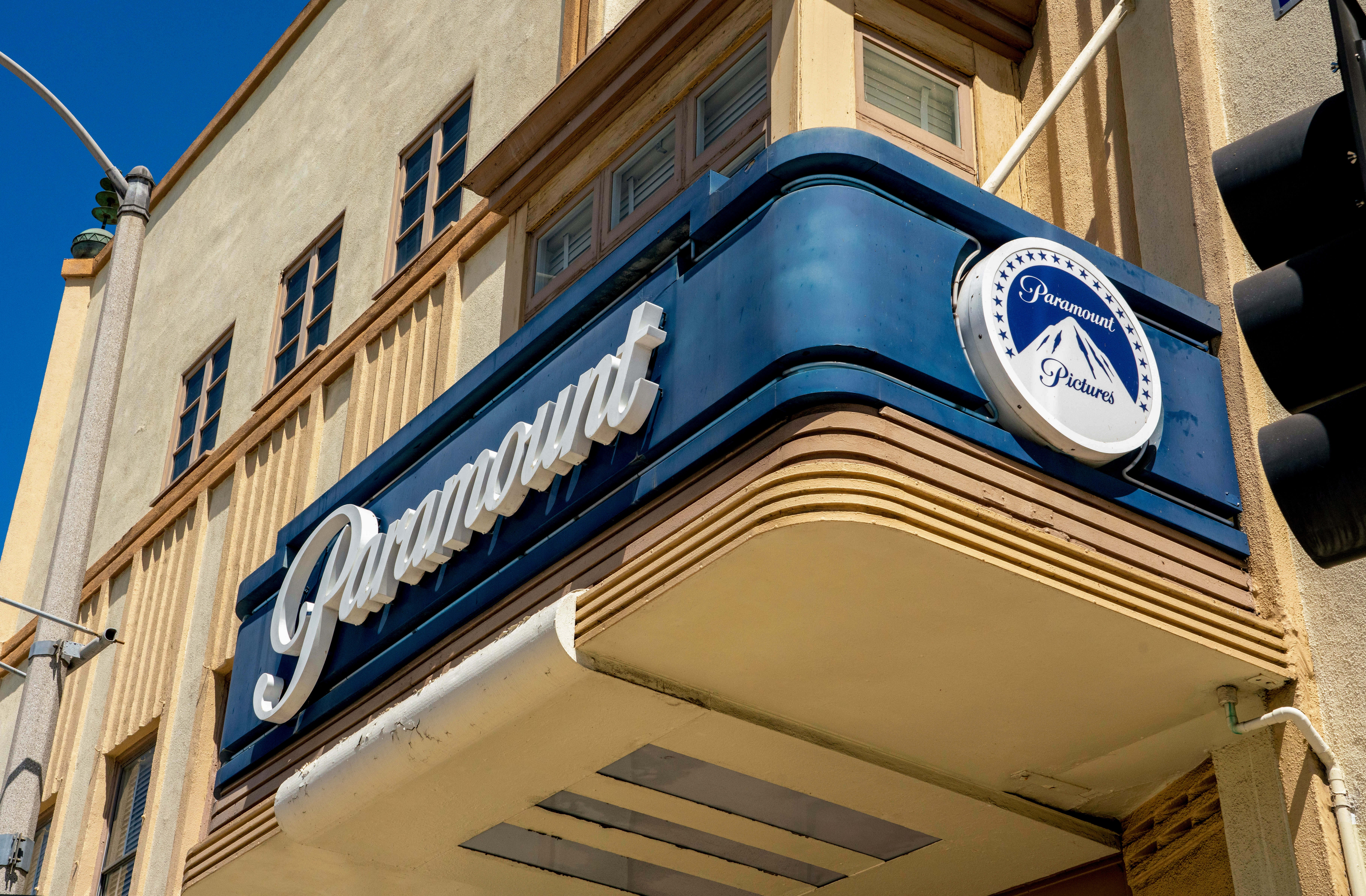 Exterior of the Paramount Theatre with its iconic marquee, seen from a lower angle showing the building&#x27;s architectural details
