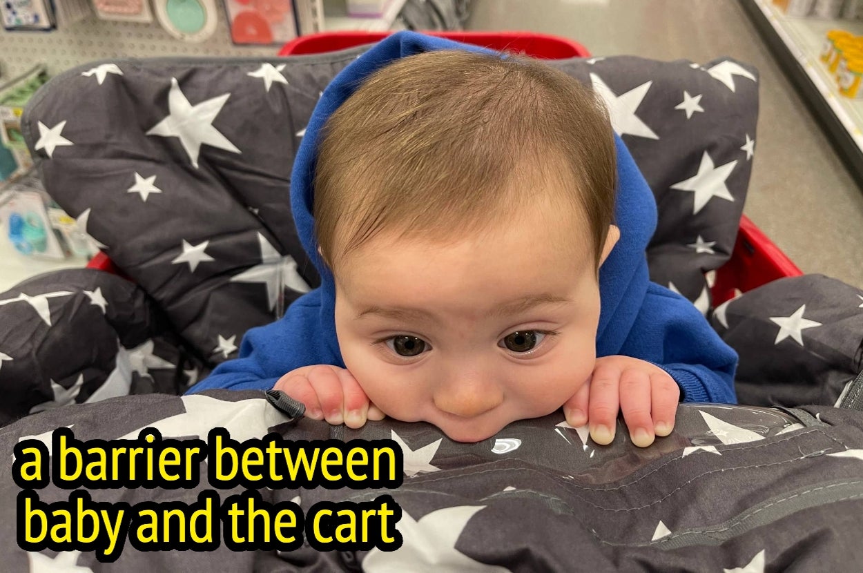 Baby in a hoodie playfully chewing on a star-patterned cart cover at a store, with text: "a barrier between baby and the cart."