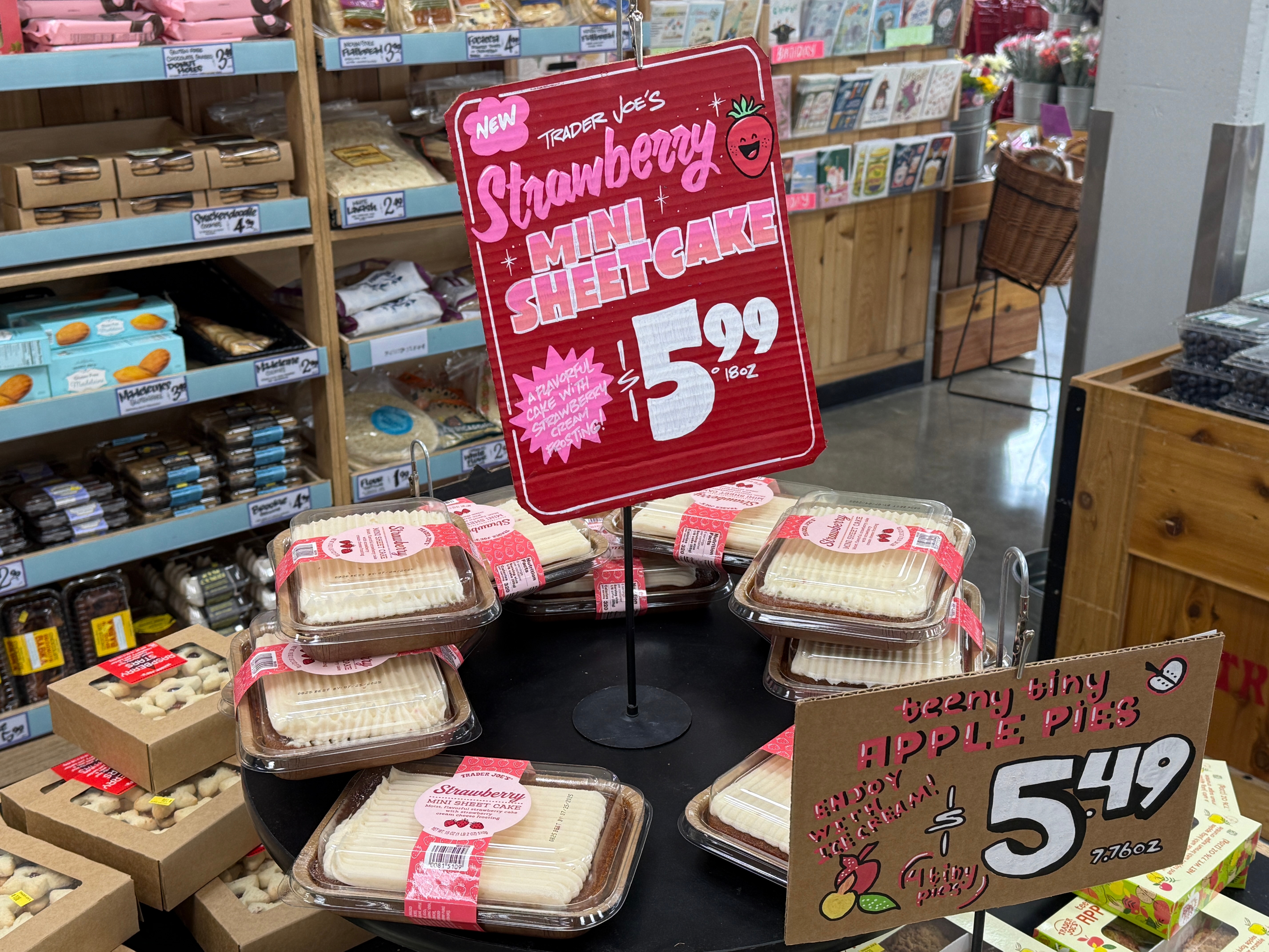 Display of Strawberry Mini Sheet Cakes and Beary Tiny Apple Pies for sale at Trader Joe's, each priced at $5.99